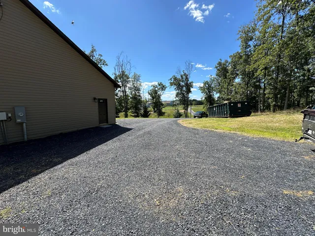 a view of a house with backyard porch and sitting area