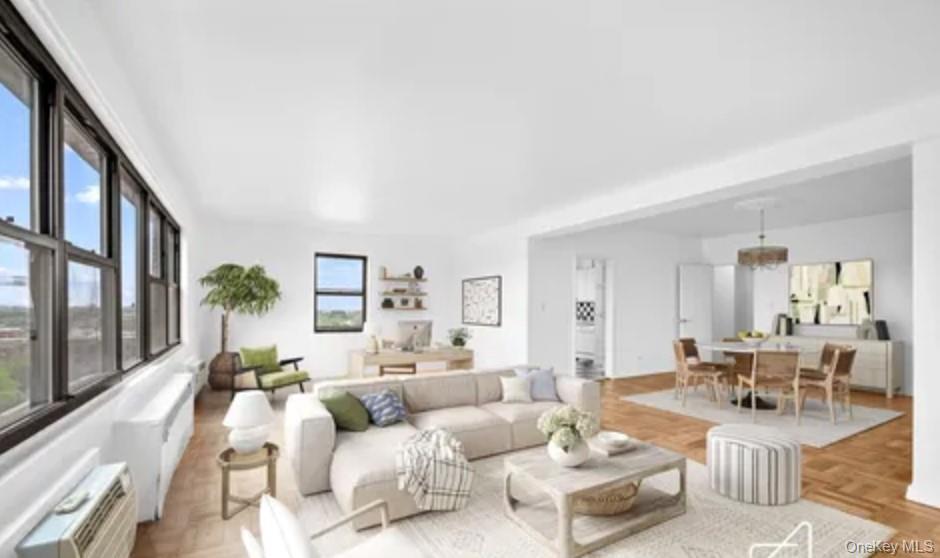 153 Dahill Road Brooklyn, NY 11218 - Photo 3 of 3 a living room with furniture potted plant and a large window