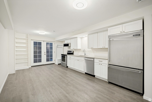 1837 Richard Road Sandy, UT 84093 - Photo 40 of 67 Basement apartment kitchen featuring a Viking refrigerator