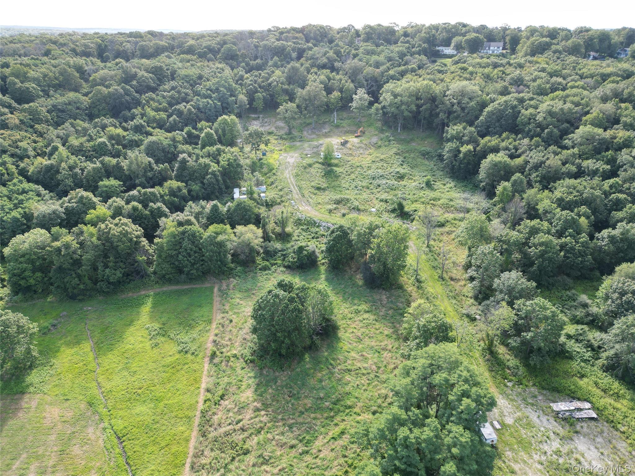 36 Gem Mountain LaGrangeville, NY 12540 - Photo 1 of 25 a view of a lake with a forest