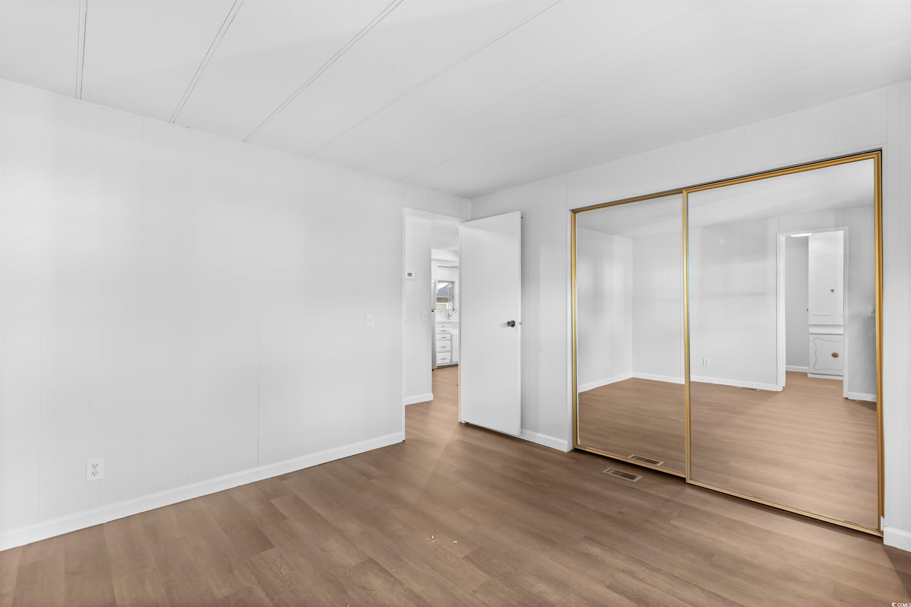 2950 Clemson Trail Murrells Inlet, SC 29576 - Photo 15 of 29 Unfurnished bedroom featuring hardwood / wood-styl