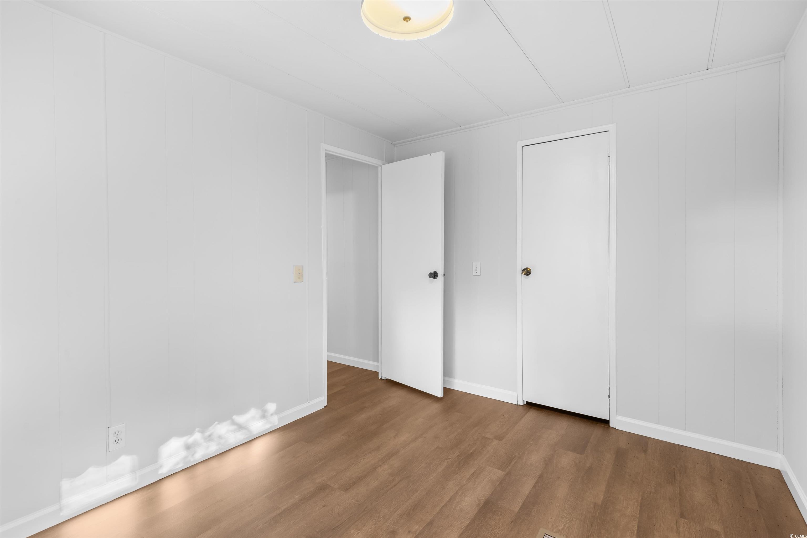 2950 Clemson Trail Murrells Inlet, SC 29576 - Photo 18 of 29 Unfurnished bedroom featuring hardwood / wood-styl