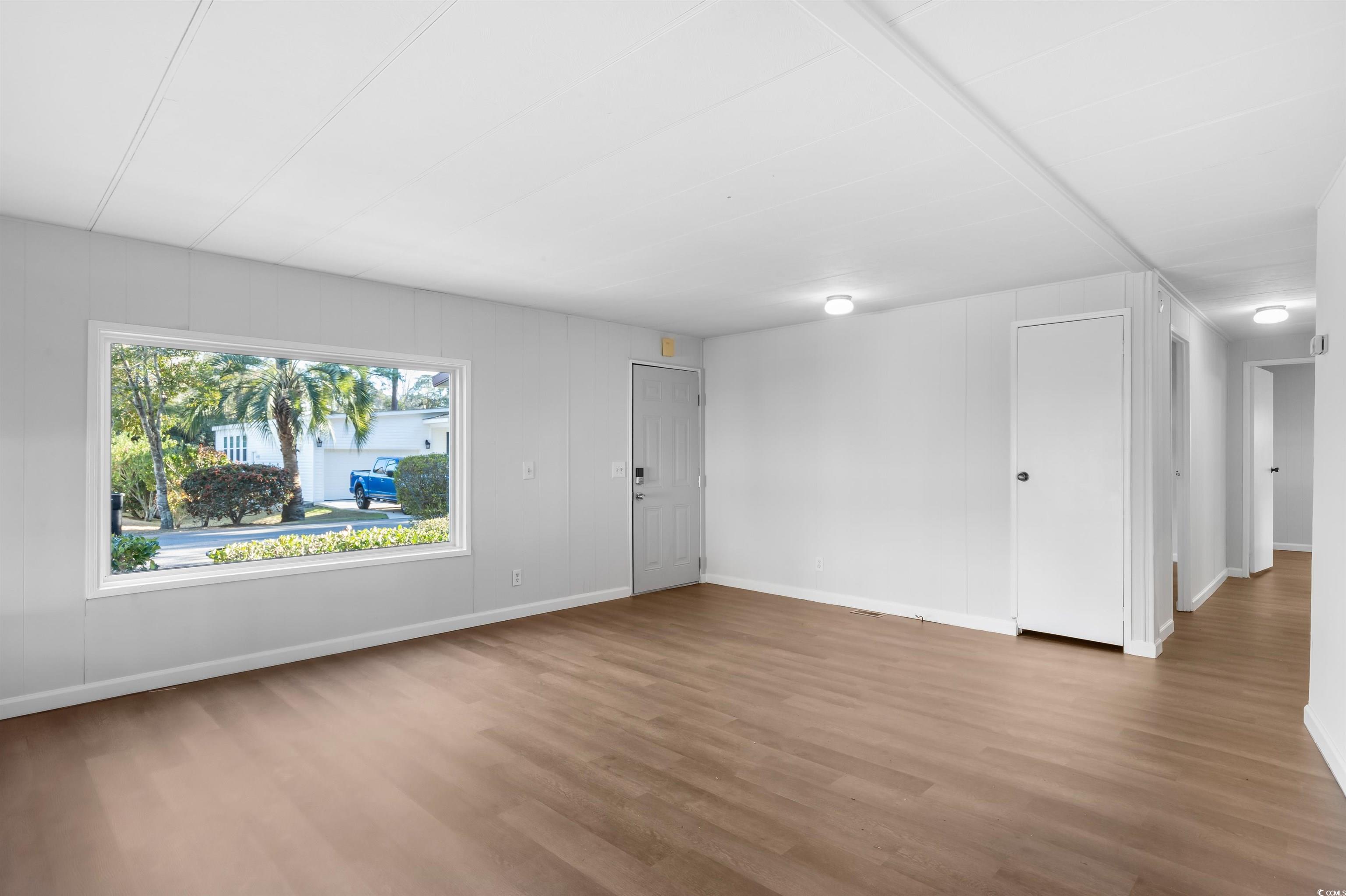 2950 Clemson Trail Murrells Inlet, SC 29576 - Photo 4 of 29 Unfurnished room with hardwood / wood-style floori