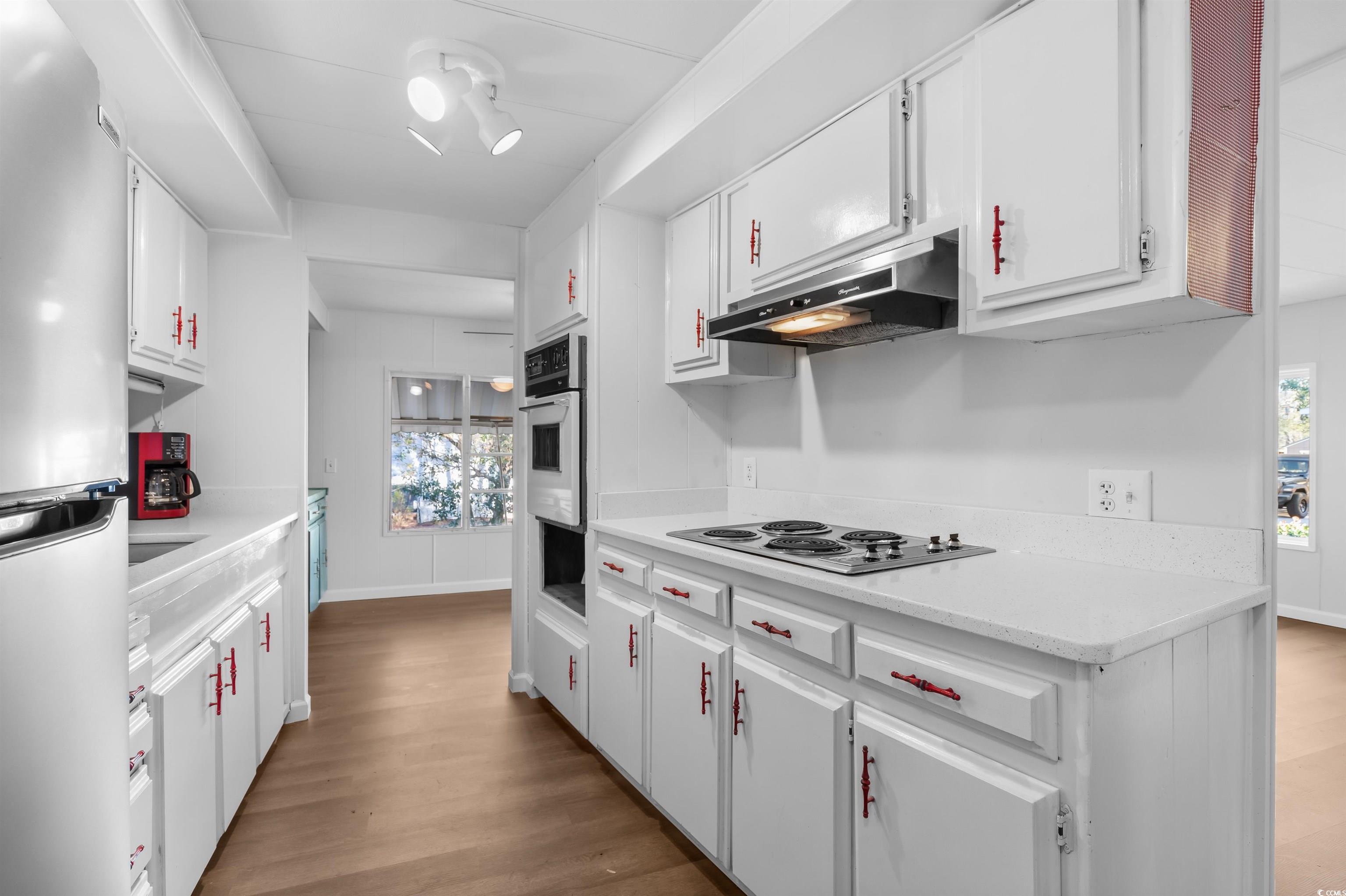 2950 Clemson Trail Murrells Inlet, SC 29576 - Photo 10 of 29 Kitchen featuring stainless steel fridge, white co