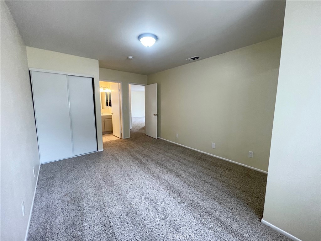 150 East Baseline Road, Unit A San Dimas, CA 91773 - Photo 12 of 13 wooden floor in an empty room with a window
