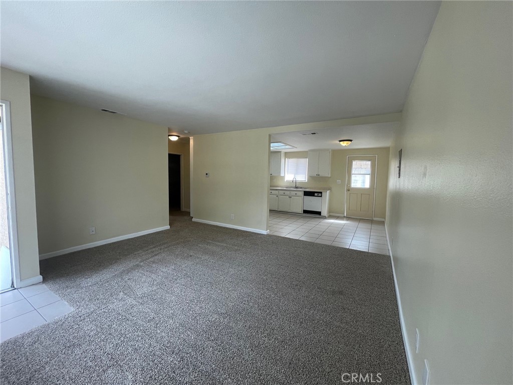 150 East Baseline Road, Unit A San Dimas, CA 91773 - Photo 3 of 13 a view of a big room with windows and chandelier fan