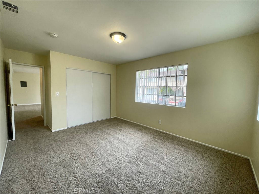 150 East Baseline Road, Unit A San Dimas, CA 91773 - Photo 9 of 13 an empty room with windows