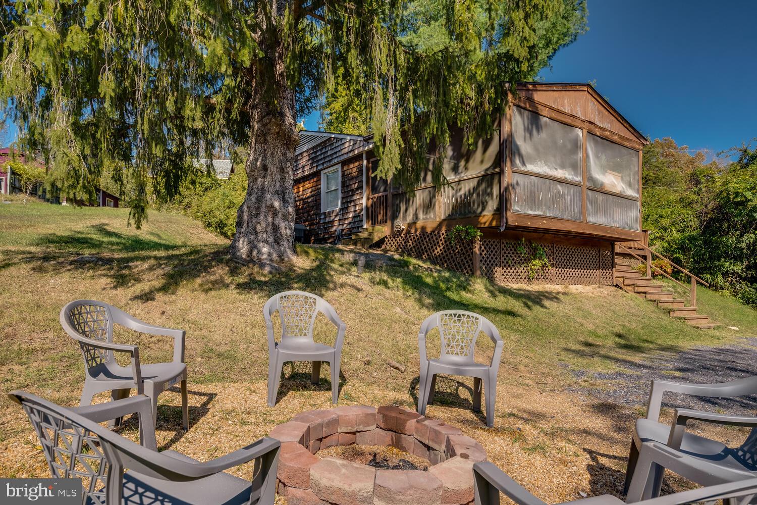 6235 South Page Valley Road Luray, VA 22835 - Photo 47 of 52 Cozy fire pit nestled in nature.