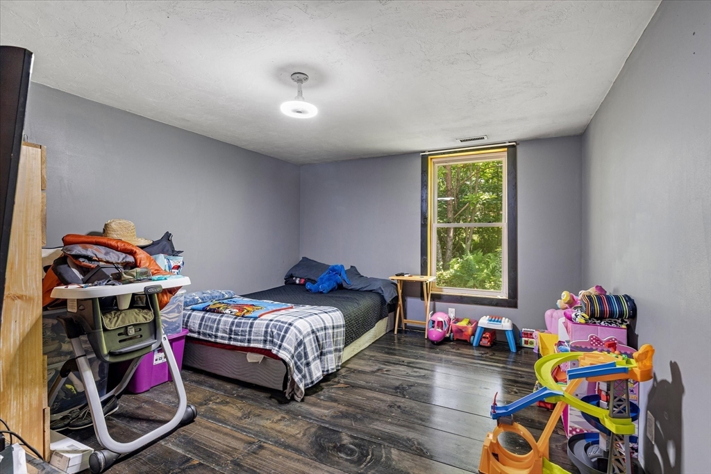 8 Oakwood Road Brimfield, MA 01010 - Photo 11 of 34 a bedroom with baby bed and a window