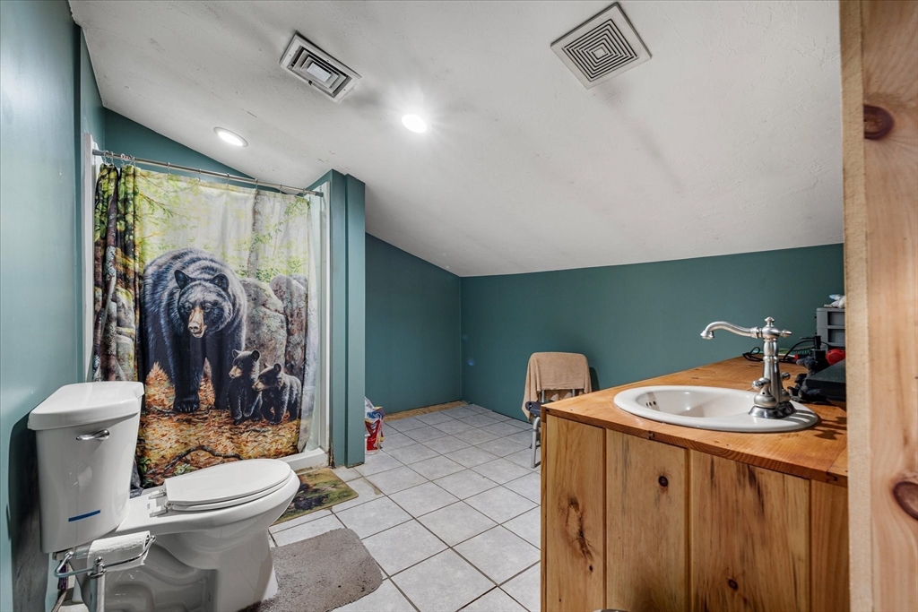 8 Oakwood Road Brimfield, MA 01010 - Photo 21 of 34 a bathroom with a toilet a sink and shower