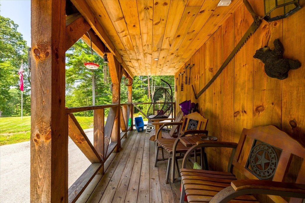8 Oakwood Road Brimfield, MA 01010 - Photo 3 of 34 a view of balcony with wooden floor and outdoor seating