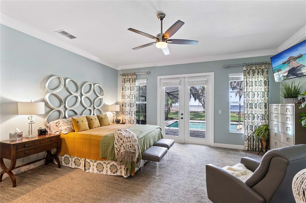 4846 Calasans Avenue St. Cloud, FL 34771 - Photo 14 of 61 a bedroom with furniture and a large window