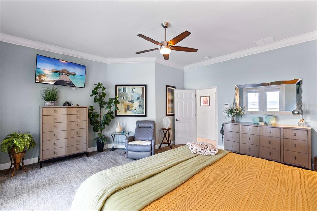 4846 Calasans Avenue St. Cloud, FL 34771 - Photo 16 of 61 a bedroom with a bed and furniture