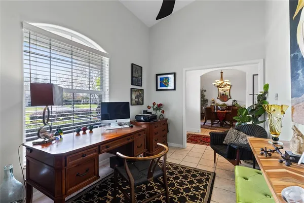 a view of a dining room with furniture chandelier and wooden floor