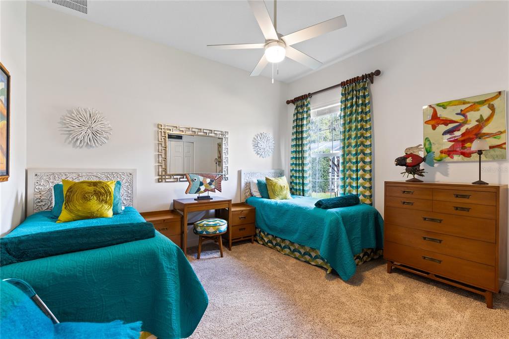 4846 Calasans Avenue St. Cloud, FL 34771 - Photo 25 of 61 a bedroom with a bed and a dresser