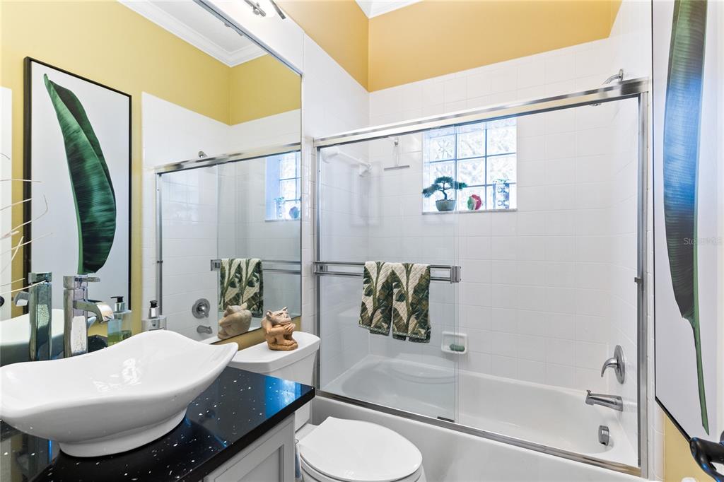 4846 Calasans Avenue St. Cloud, FL 34771 - Photo 27 of 61 a bathroom with a sink toilet and shower