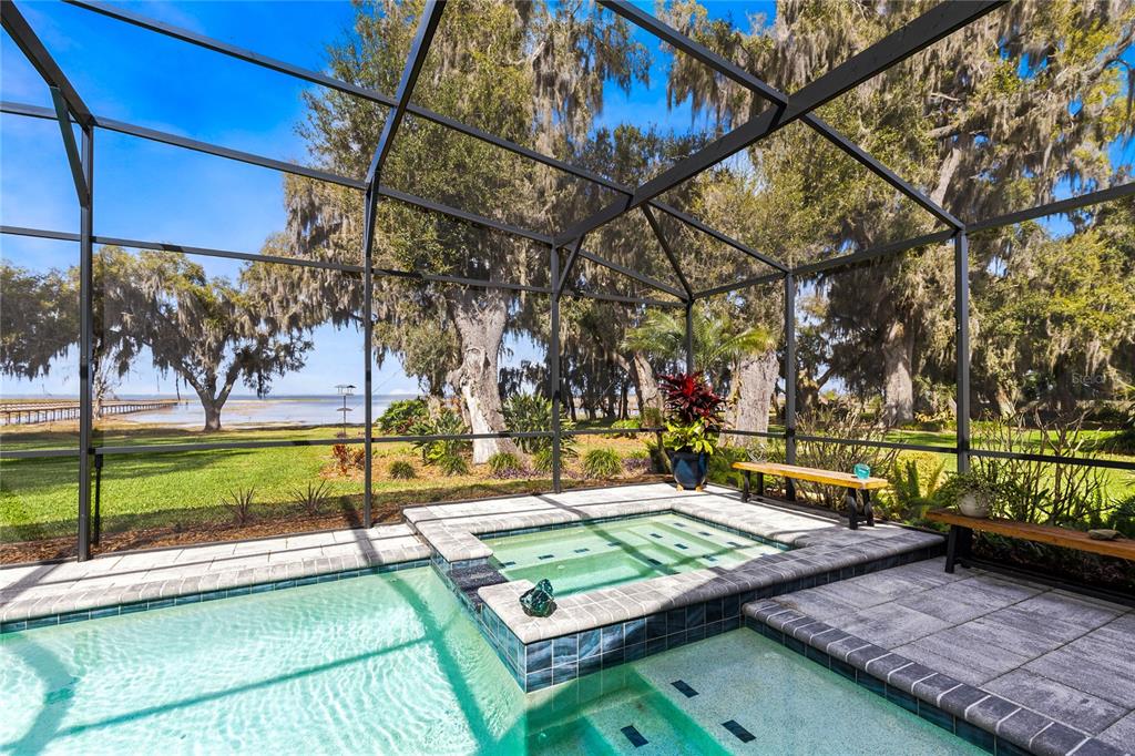 4846 Calasans Avenue St. Cloud, FL 34771 - Photo 34 of 61 a view of a swimming pool with a patio and a yard