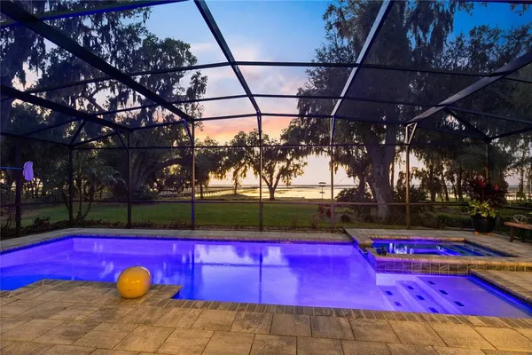 a view of swimming pool with an outdoor space and seating area