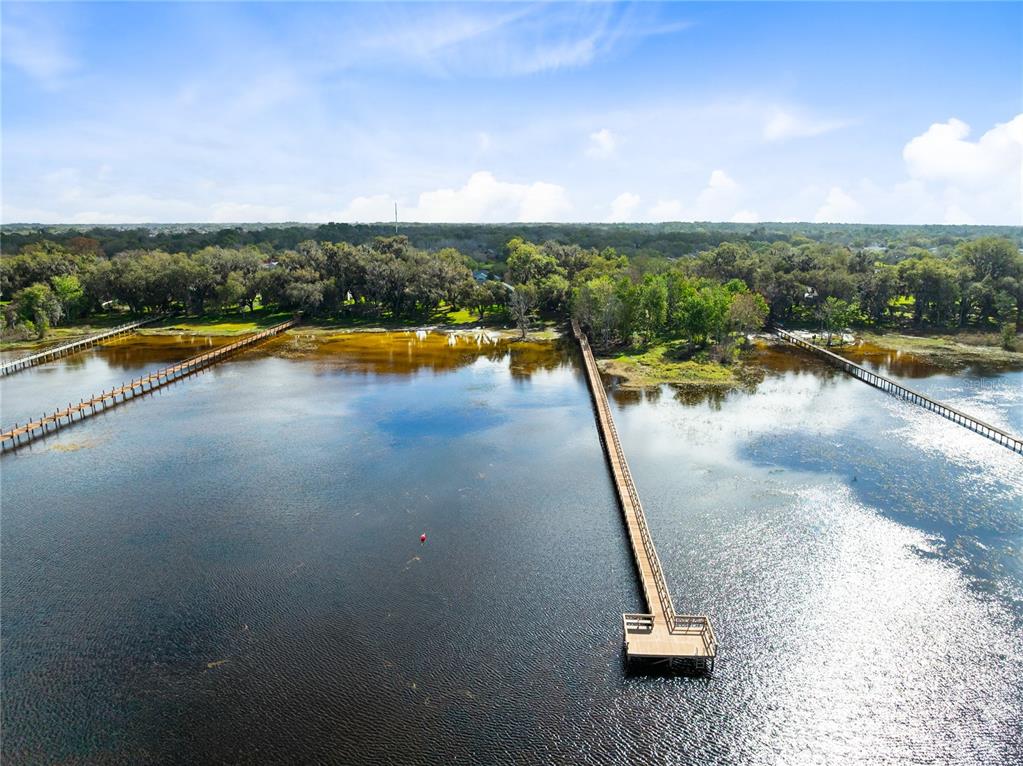 4846 Calasans Avenue St. Cloud, FL 34771 - Photo 45 of 61 a view of a swimming pool and lake