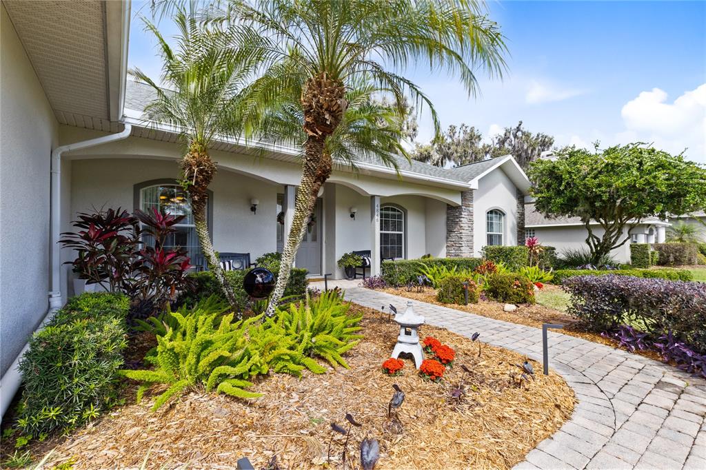 4846 Calasans Avenue St. Cloud, FL 34771 - Photo 49 of 61 a front view of a house with a garden