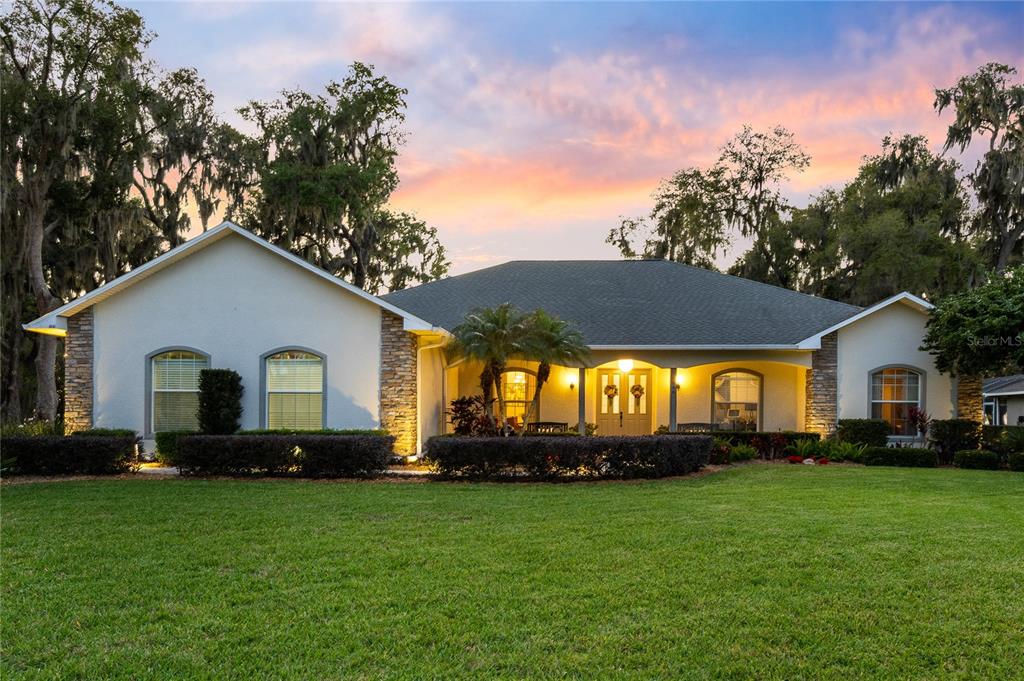 4846 Calasans Avenue St. Cloud, FL 34771 - Photo 52 of 61 a front view of house with yard and green space