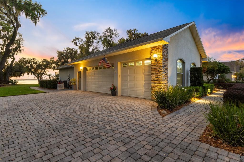 4846 Calasans Avenue St. Cloud, FL 34771 - Photo 55 of 61 a front view of a house with a yard and a garage