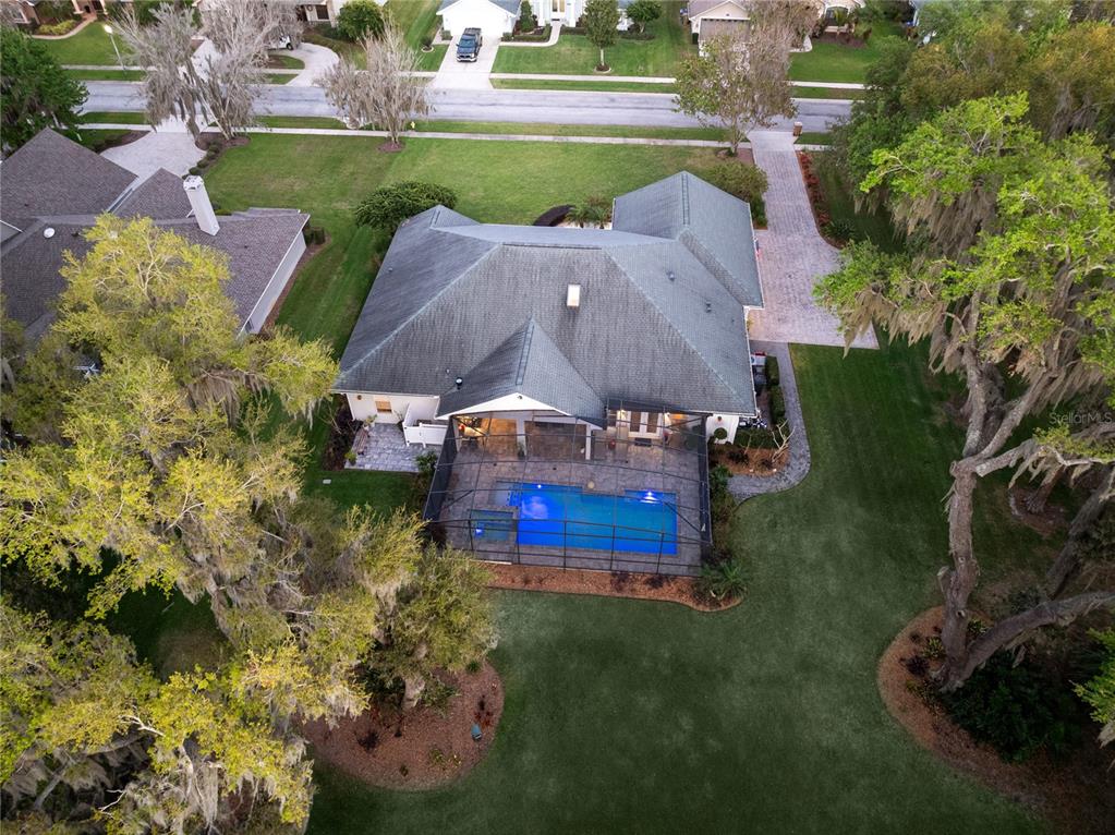 4846 Calasans Avenue St. Cloud, FL 34771 - Photo 57 of 61 an aerial view of a house with a garden