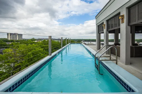 a view of swimming pool from a balcony