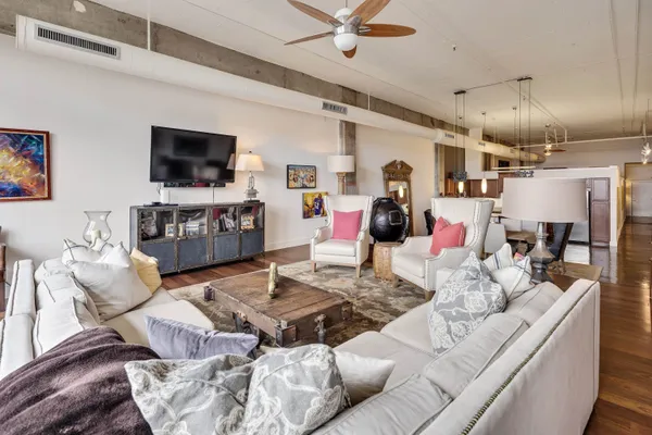 a living room with furniture and a flat screen tv