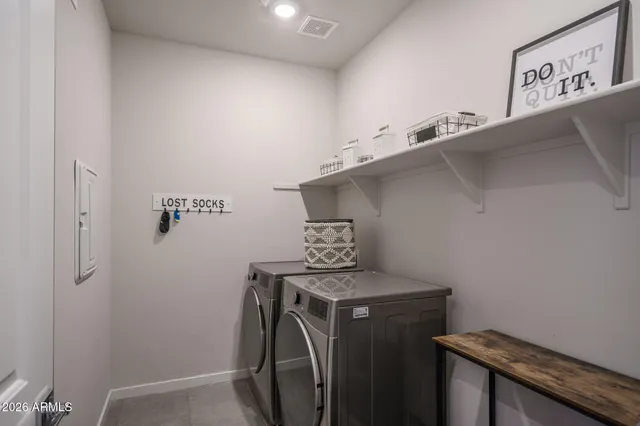 a bathroom with a double vanity sink toilet and a mirror