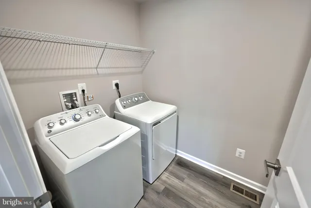 a bathroom with a bathtub and a sink
