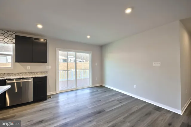 a kitchen with a stove and a microwave