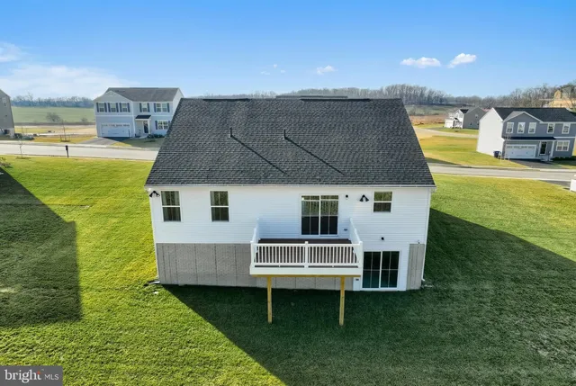 a aerial view of a house with a garden and plants