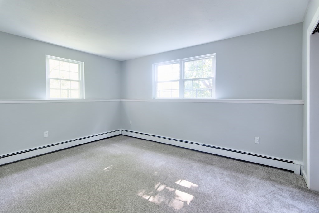 64 Jacqueline Road, Unit 3 Waltham, MA 02452 - Photo 17 of 27 an empty room with a window