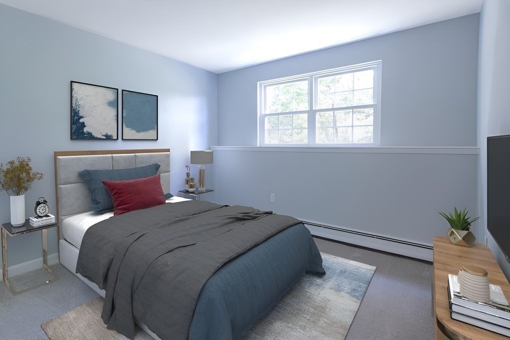 64 Jacqueline Road, Unit 3 Waltham, MA 02452 - Photo 6 of 27 a bedroom with a bed and a window