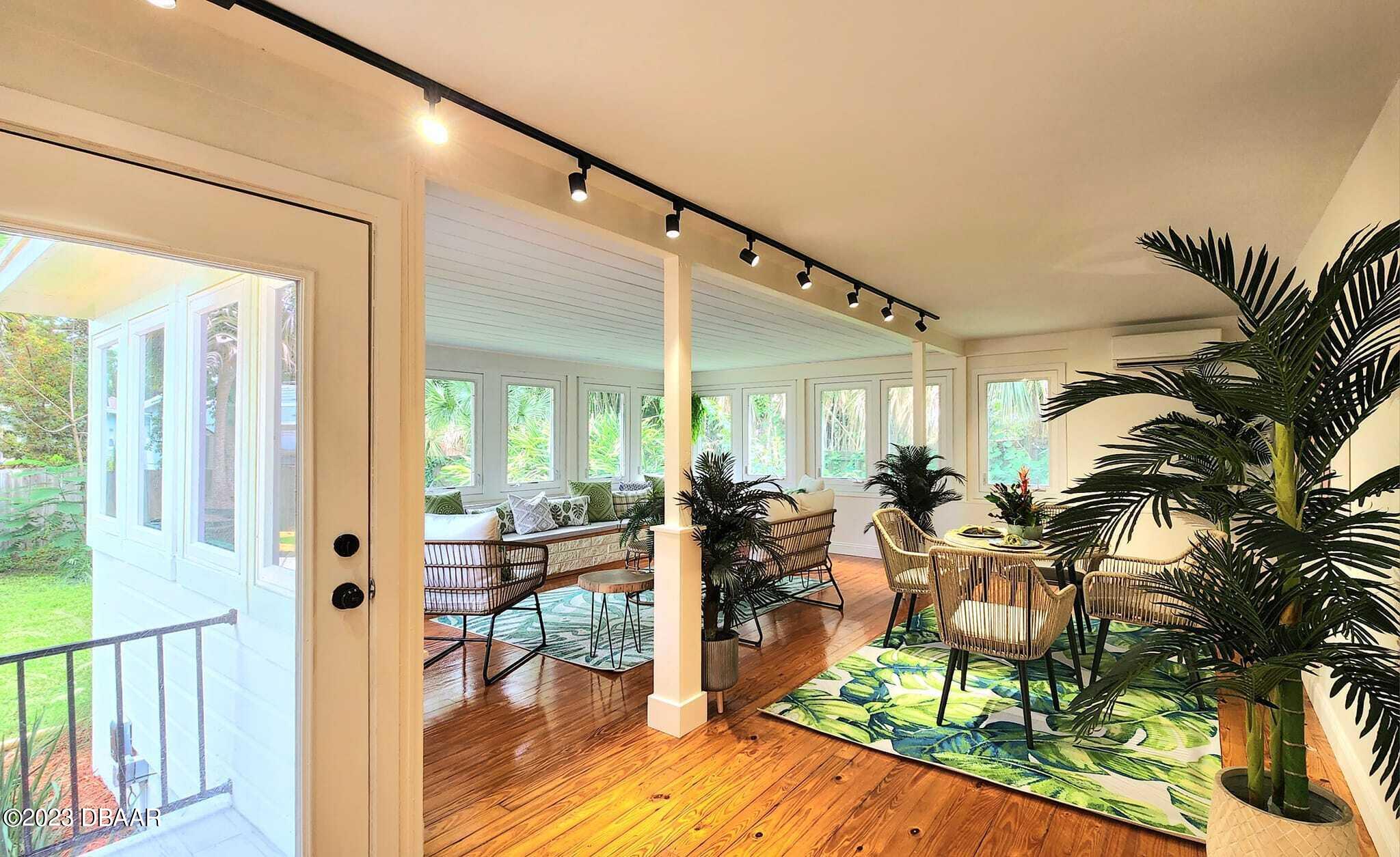 912 North Halifax Drive Ormond Beach, FL 32176 - Photo 17 of 65 a very nice looking living room with a large window