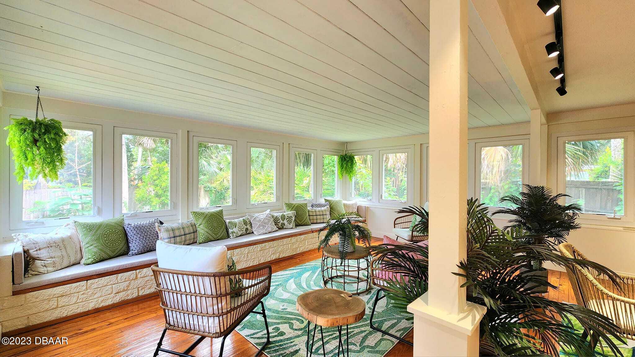 912 North Halifax Drive Ormond Beach, FL 32176 - Photo 20 of 65 a living room with furniture and a large window