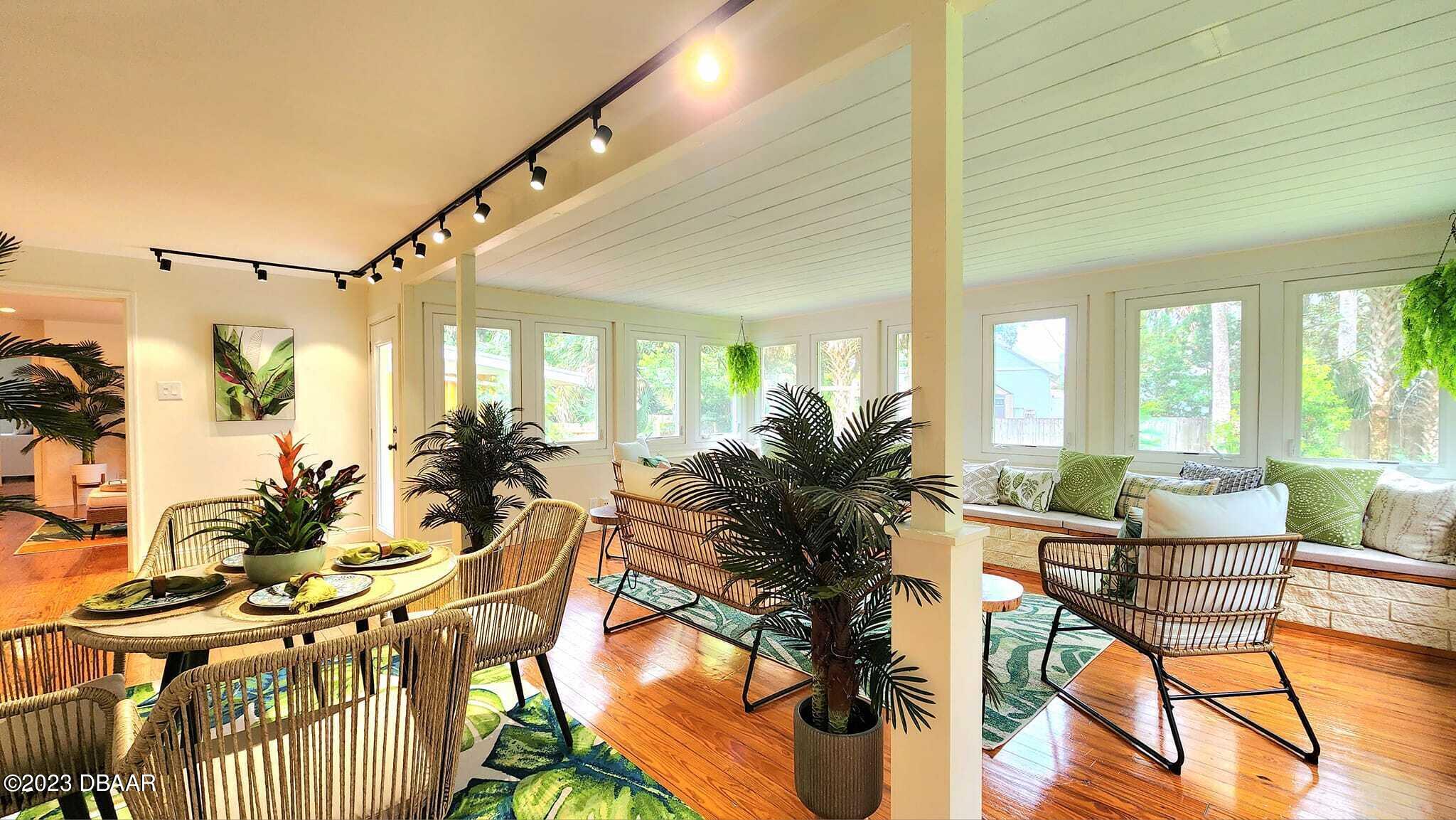 912 North Halifax Drive Ormond Beach, FL 32176 - Photo 21 of 65 a living room with furniture and a large window