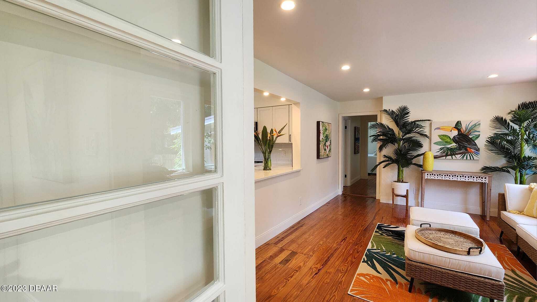 912 North Halifax Drive Ormond Beach, FL 32176 - Photo 26 of 65 Door to den and kitchen