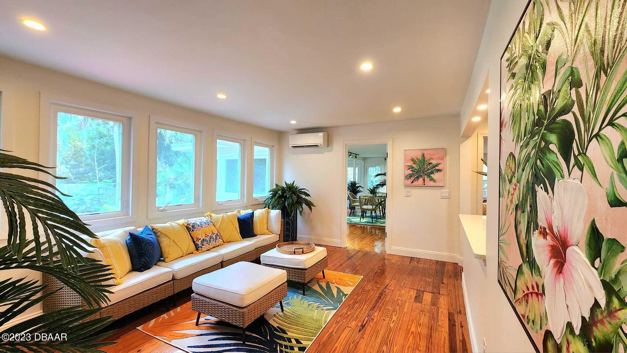 912 North Halifax Drive Ormond Beach, FL 32176 - Photo 28 of 65 a living room with furniture and a rug