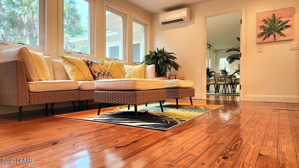 912 North Halifax Drive Ormond Beach, FL 32176 - Photo 31 of 65 a living room with furniture and a large window