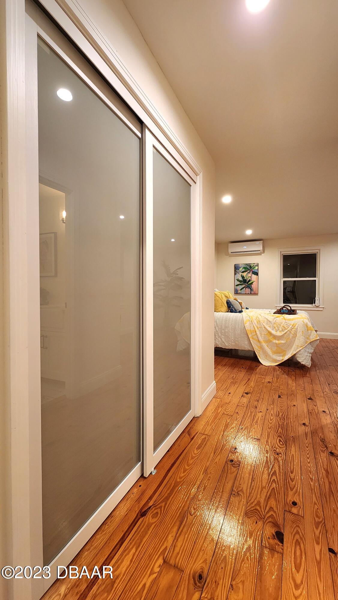 912 North Halifax Drive Ormond Beach, FL 32176 - Photo 42 of 65 a bedroom with a bed and flat screen tv