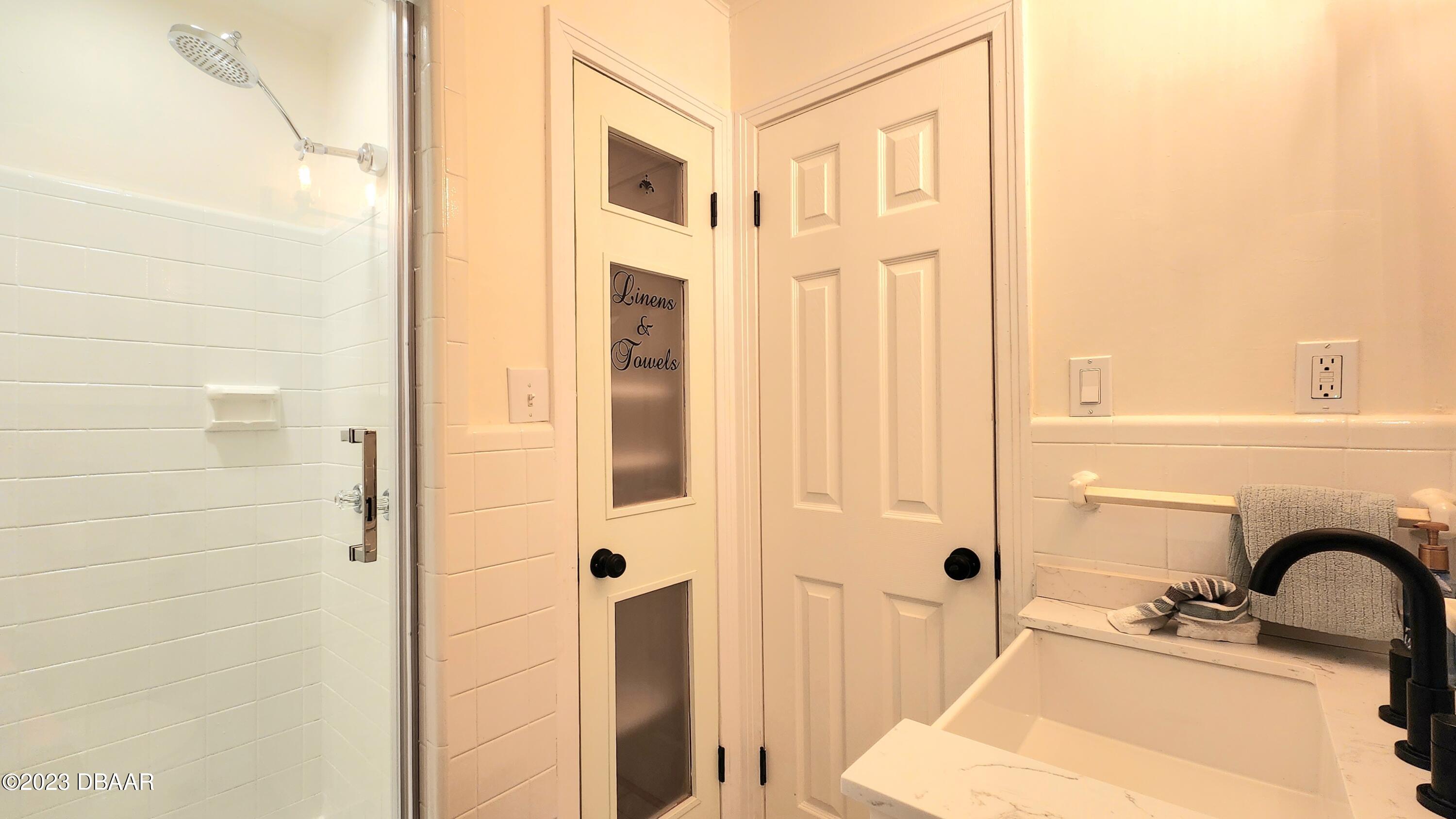 912 North Halifax Drive Ormond Beach, FL 32176 - Photo 47 of 65 a bathroom with a sink and mirror