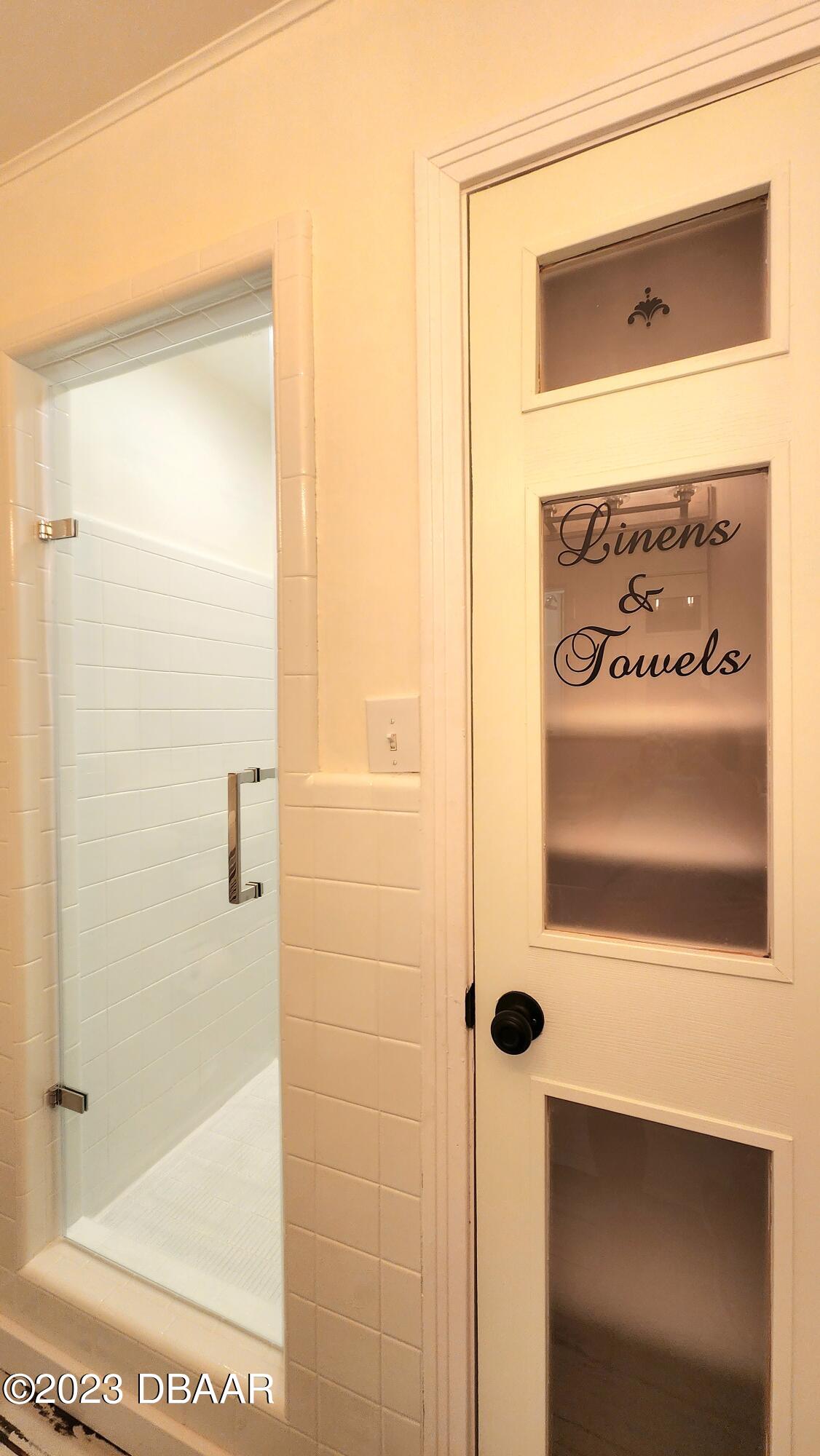 912 North Halifax Drive Ormond Beach, FL 32176 - Photo 49 of 65 a bathroom with a shower and a mirror
