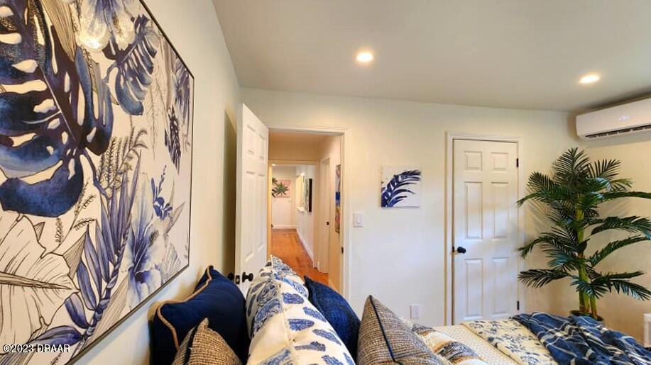 912 North Halifax Drive Ormond Beach, FL 32176 - Photo 53 of 65 a bedroom with a bed and a painting on the wall