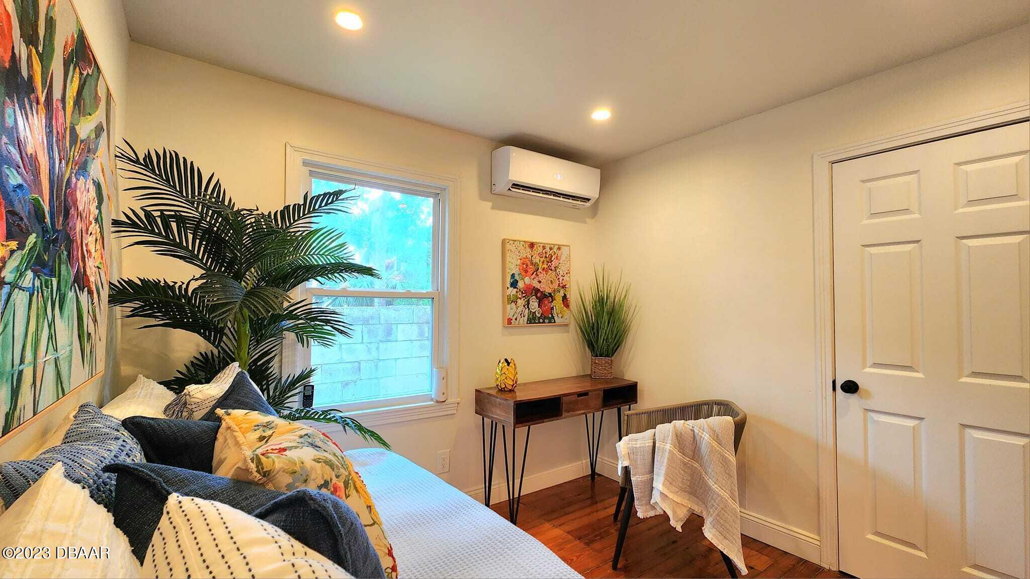 912 North Halifax Drive Ormond Beach, FL 32176 - Photo 60 of 65 a living room with furniture and a potted plant
