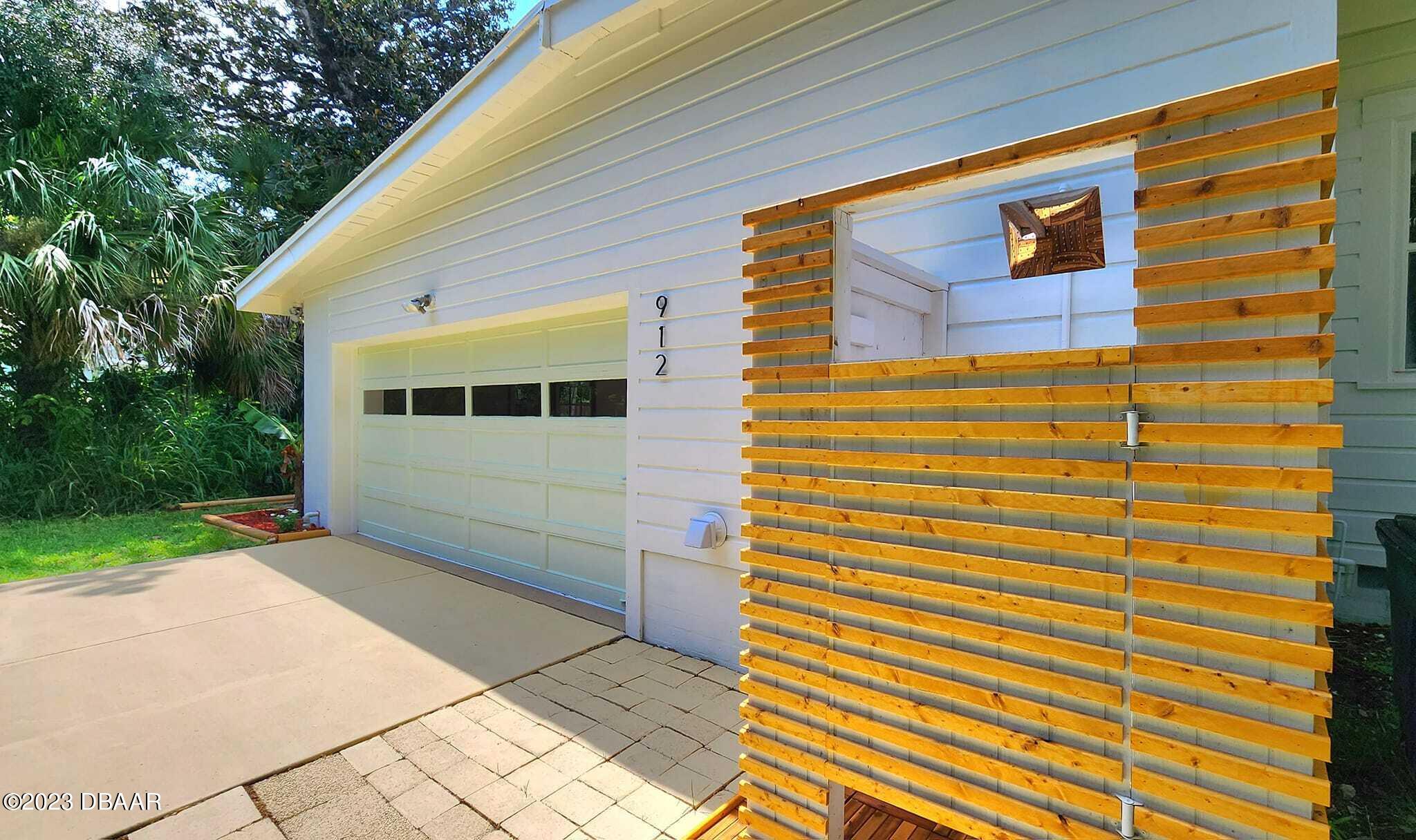 912 North Halifax Drive Ormond Beach, FL 32176 - Photo 8 of 65 a view of front door of house