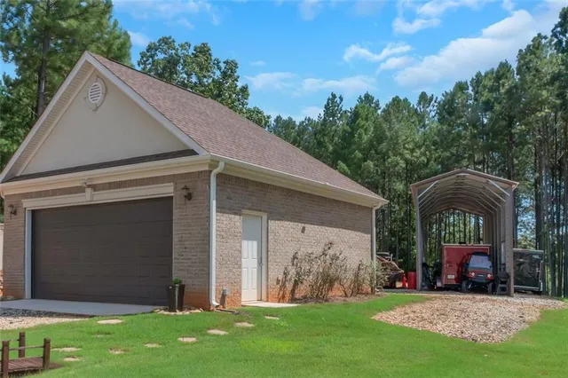 a spacious bathroom with a tub a double vanity sink and mirror