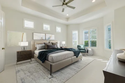a living room with a bed furniture and a large window