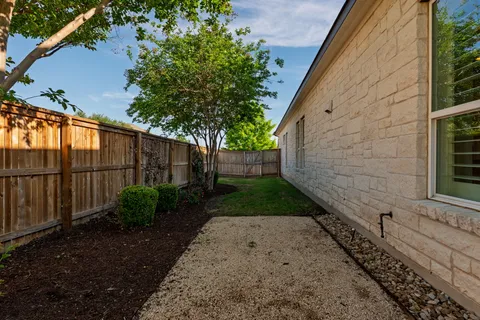 a backyard of a house with lots of green space